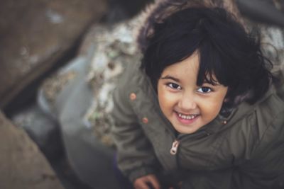 Portrait of cute girl smiling outdoors