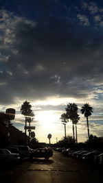 Road against cloudy sky at sunset