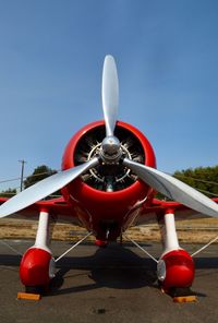 Airplane on runway against clear sky