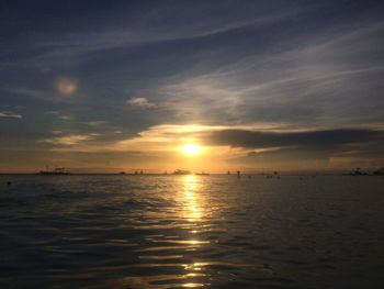 Scenic view of sea against sky at sunset