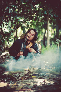 Portrait of a young woman in the forest