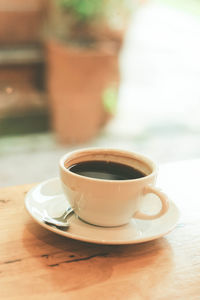 Close-up of coffee cup on table