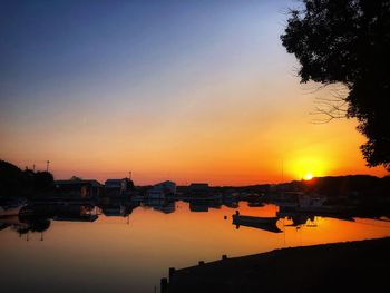 Scenic view of lake against romantic sky at sunset