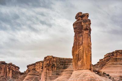 Low angle view of rock formations against sky at arches national park