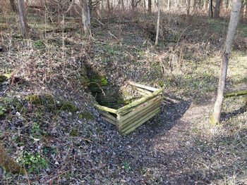 High angle view of abandoned bench on field