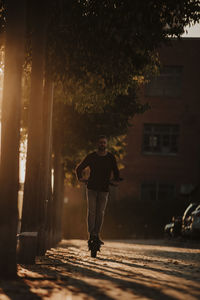 Full length portrait of man in city