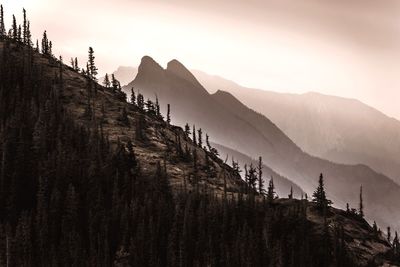 Panoramic view of land and mountains against sky