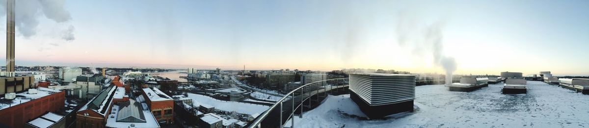 Panoramic view of buildings against sky at dusk