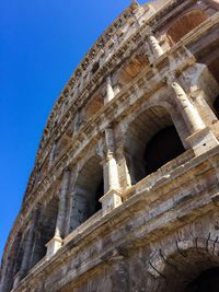 Low angle view of historical building against blue sky