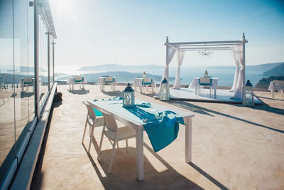 Chairs and tables at swimming pool