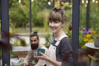 Portrait of young woman using mobile phone