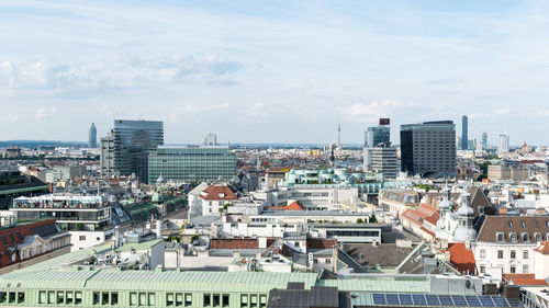 High angle view of buildings in city against sky