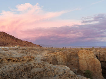 Scenic view of rocky mountains against sky during sunset