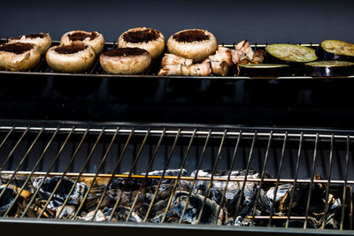 High angle view of fish on barbecue grill