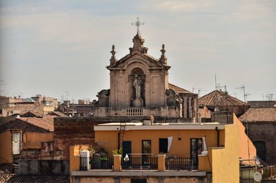 View of buildings in city against sky