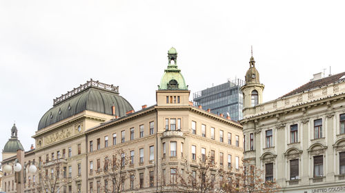 Low angle view of buildings against clear sky