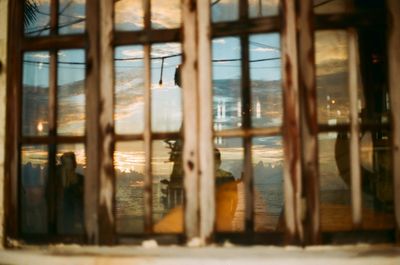 Reflection of building on glass window