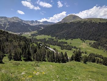 Scenic view of landscape and mountains against sky