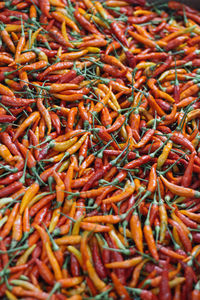 Full frame shot of red chili peppers for sale in market