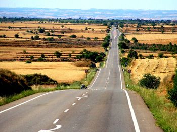 Empty road along landscape