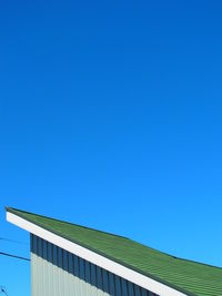 Low angle view of building against blue sky