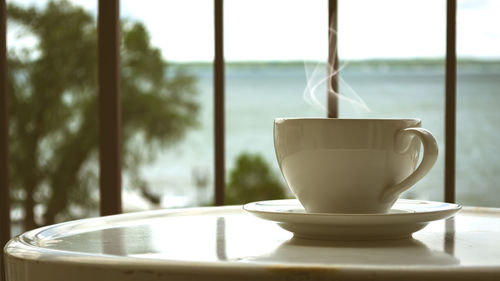 Close-up of coffee cup on table