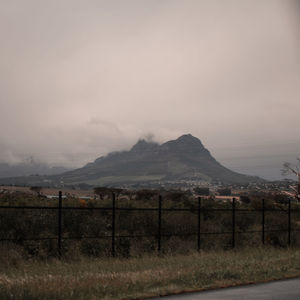 Scenic view of landscape and mountains against sky