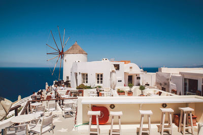 Tables and chairs at oia
