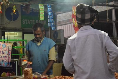 Men in traditional clothing at night