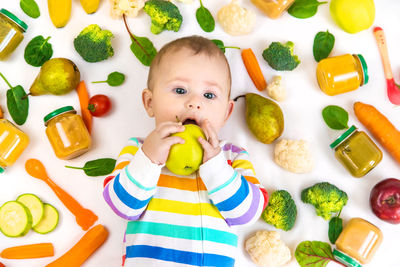 High angle view of cute boy playing with toys