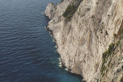 High angle view of rocks on sea shore