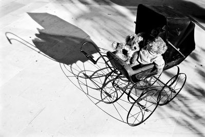 High angle view of baby carriage with toys