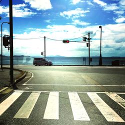 View of road against cloudy sky