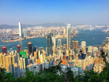 View of cityscape against blue sky