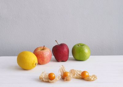 Close-up of apples and fruits on table