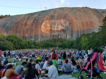 Crowd against stone mountain