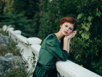 Portrait of young woman standing outdoors