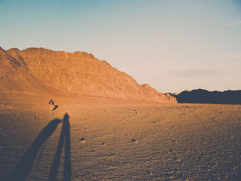 Scenic view of desert against clear sky