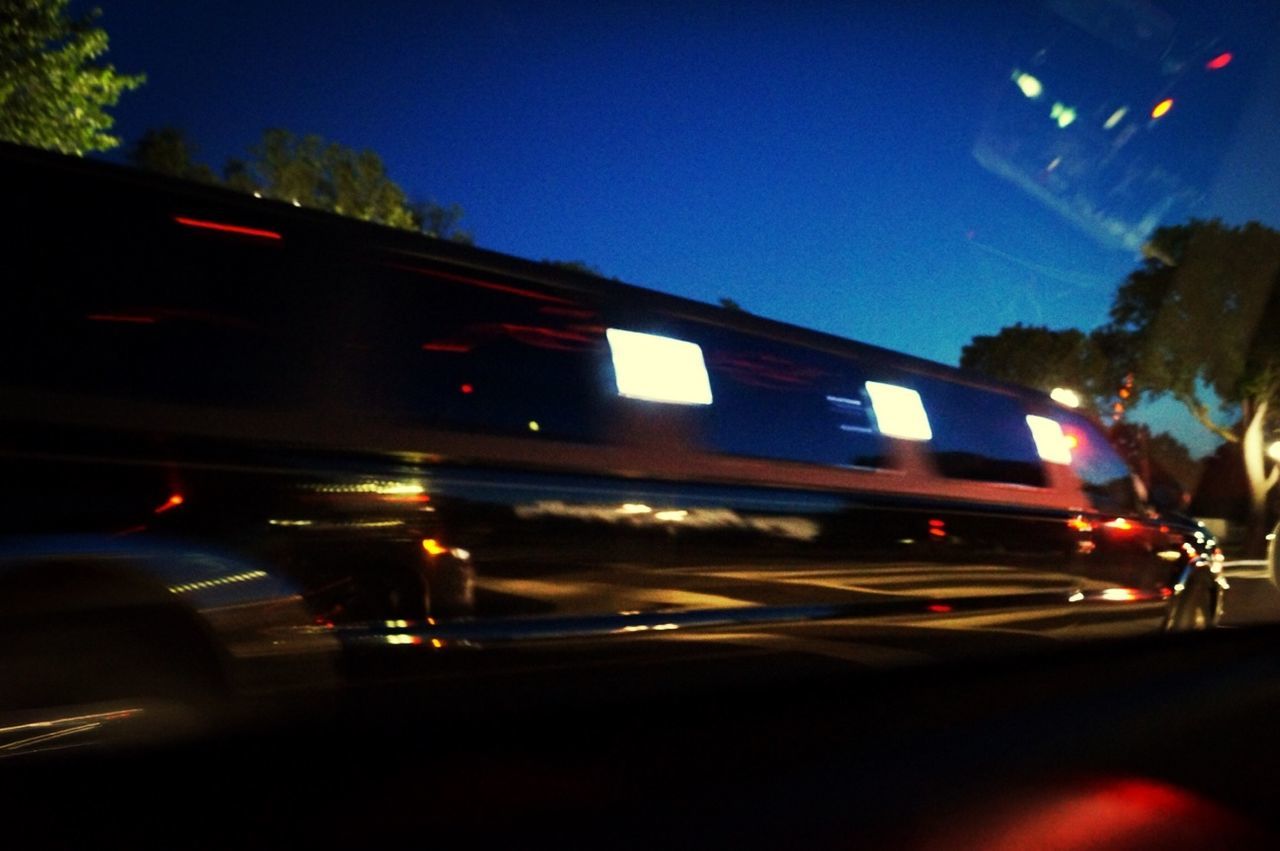 transportation, mode of transport, illuminated, car, land vehicle, night, road, on the move, speed, street, traffic, motion, travel, blurred motion, road marking, tail light, headlight, windshield, long exposure, light trail