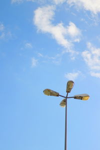 Low angle view of street light against sky