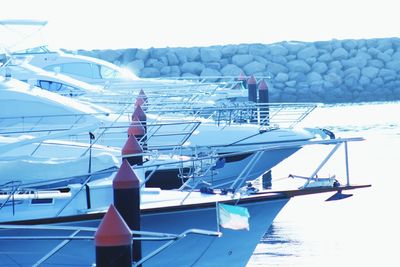 Yachts moored at harbor