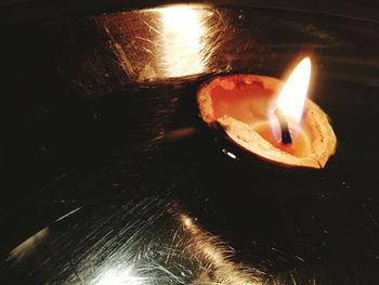 Close-up of lit tea light candle