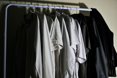 Clothes hanging on rack in store