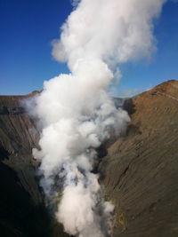 Scenic view of volcanic mountain against sky