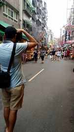 People walking on road in city