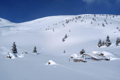 Scenic view of snow covered mountain against sky