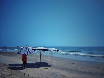 Scenic view of beach against clear sky