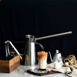 Teh c peng in glass on table