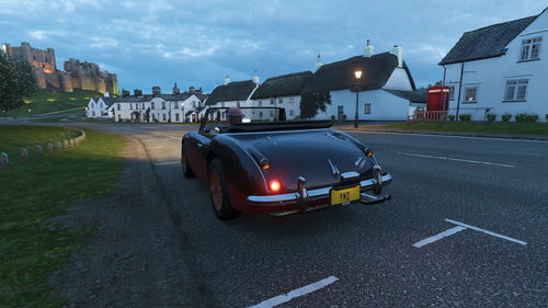 Car on street against buildings in city