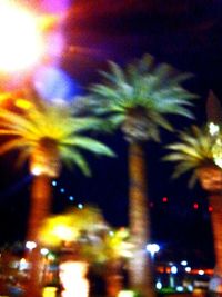 Defocused image of illuminated city at night